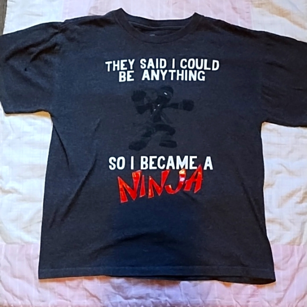 A dark gray shirt with grific lettering
